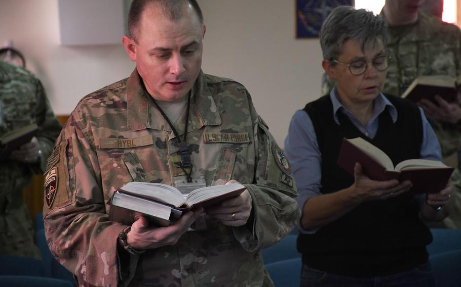 Servicemembers and contractors from the U.S. and other NATO coalition countries sing hymns at a Protestant Easter service at NATO's Resolute Support headquarters in Kabul, Afghanistan, on Sunday, April 21, 2019.
