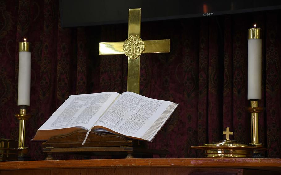 The Bible and cross are displayed at an Easter service at NATO's Resolute Support headquarters in Kabul, Afghanistan, on Sunday, April 21, 2019. 
