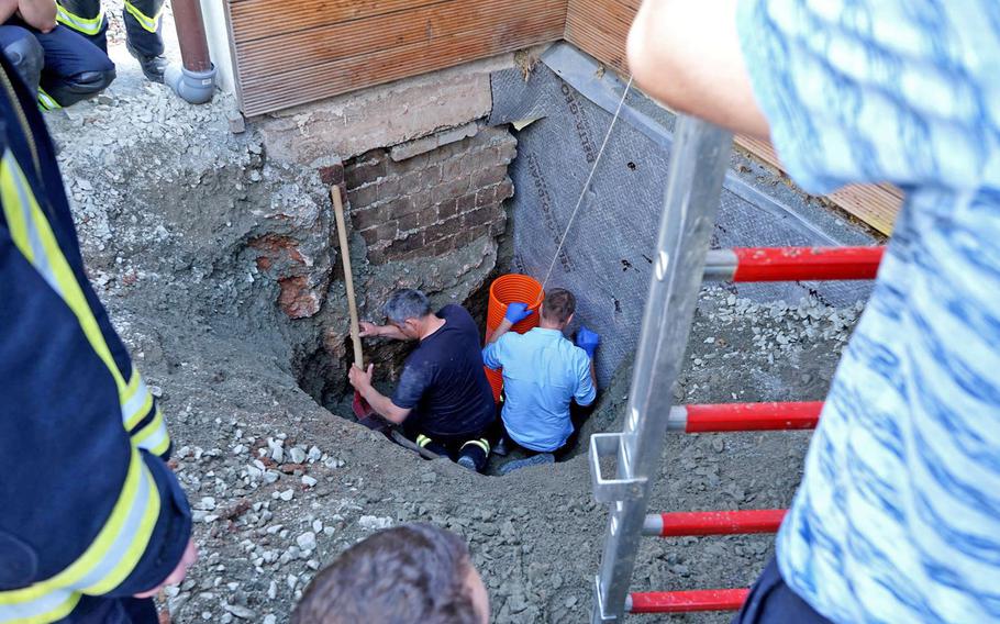 Police work to rescue a 17-month-old boy who fell into a nearly 10-foot shaft in Erzenhausen, Germany, just north of Ramstein Air Base, on April 22, 2019. 

