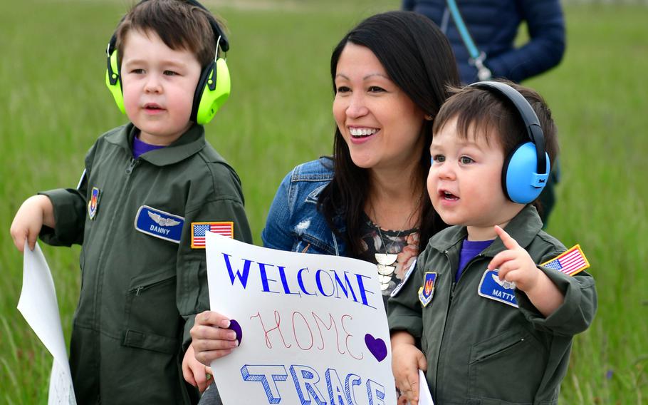 Family members of redeploying airmen with the 510th Fighter Squadron, 31st Fighter Wing, Aviano Air Base, Italy, excitedly await the arrival of their loved ones at Aviano's airfield, on Tuesday, April 30, 2019.