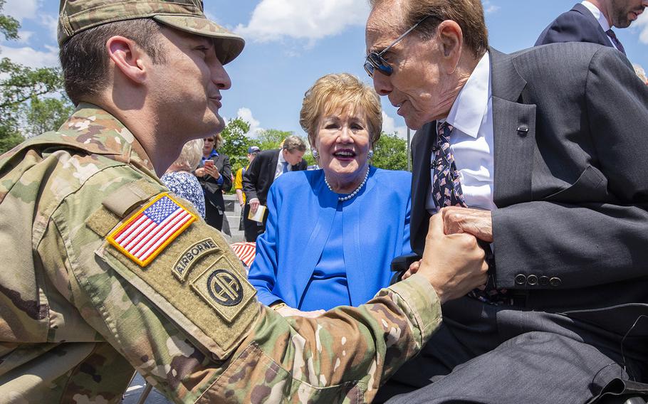 Former Sen. Bob Dole shakes hands with Lt. Col. Michael Lind with the Army's G-1 office during Dole's honorary promotion ceremony at the World War II Memorial in Washington, D.C., May 16, 2019. Dole, who was medically discharged as a captain after being severely wounded in WWII, was promoted to colonel.