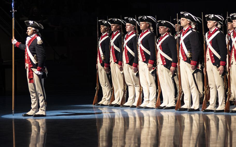 Members of the Old Guard dressed in Revolutionary War-style uniforms open up the Twilight Tattoo on June 19 at Joint Base Myer-Henderson in Arlington, Virginia.