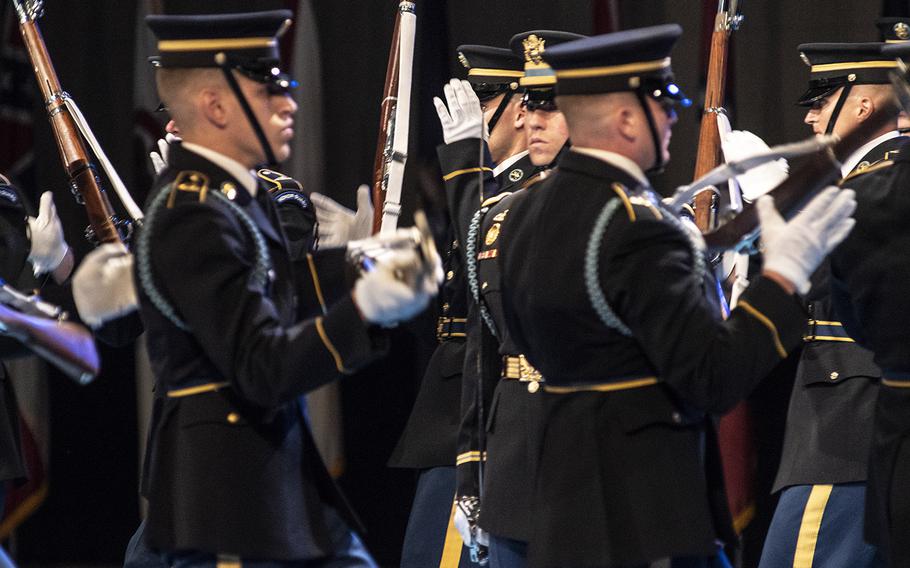 Members of the U.S. Army Drill Team perform a highly-regimented drill during the Twilight Tattoo on June 19 at Joint Base Myer-Henderson in Arlington, Virginia.