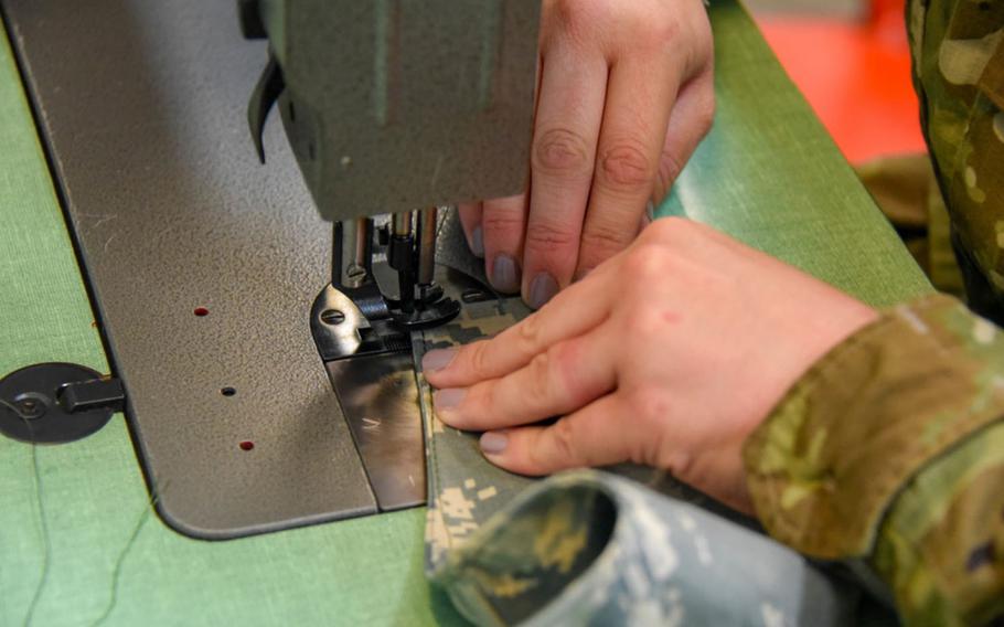An airman sews face masks for members of the 134th Air Refueling Wing on April 8, 2020, at McGhee Tyson Air National Guard Base in Tennessee.