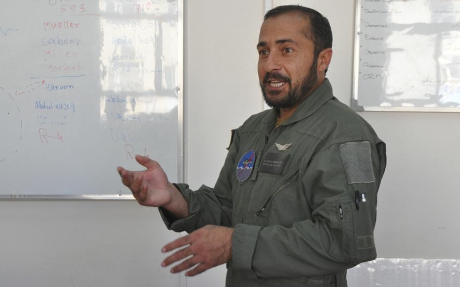 First Lt. Abdul Saboor, a pilot with the Afghan Air Force, leads a debriefing at Shindand Air Base after a training flight. ''We want to defend Afghanistan,'' he later said, ''and if the people see us taking control of our security, we will feel more together as a country.''