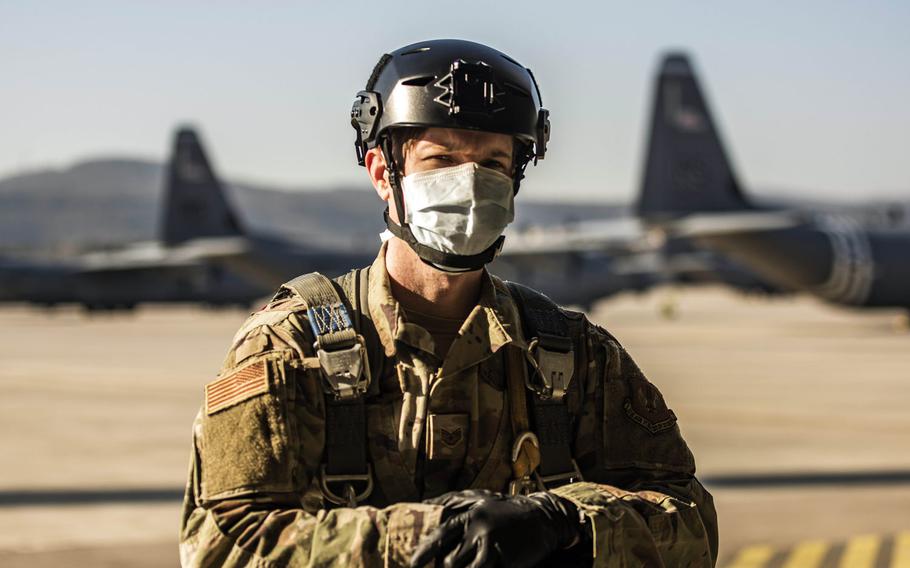 U.S. Air Force Staff Sgt. Kyle Lock, 435th Security Forces Squadron team member, prepares to board a C-130J Super Hercules aircraft at Ramstein Air Base, Germany, April 7, 2020. Lock is wearing a cloth mask and gloves to prevent the transmission of the coronavirus 


