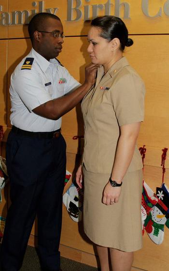 Walt Daniel, now a retired Coast Guard officer, pins the Navy lieutenant junior grade rank on his wife, Rebekah Daniel during her promotion ceremony in 2012. The picture was taken on the labor and delivery floor of Naval Hospital Bremerton in Washington, where she worked as a nurse and where she died in childbirth in March 2014.