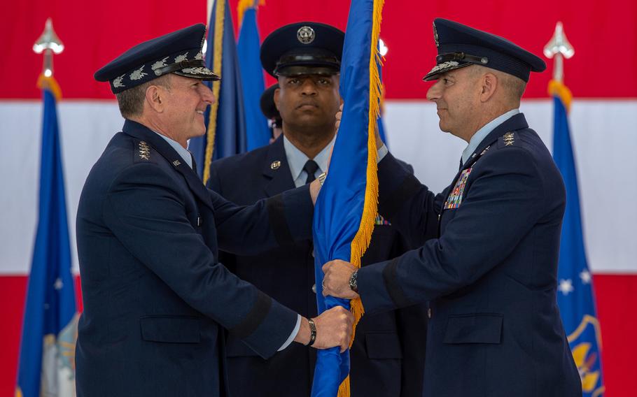 U.S. Air Force Chief of Staff Gen. David L. Goldfein passes the guidon to new U.S. Air Forces in Europe and Air Forces Africa Commander Gen. Jeffery L. Harrigian at a change of command ceremony at Ramstein Air Base, May 1, 2019. 