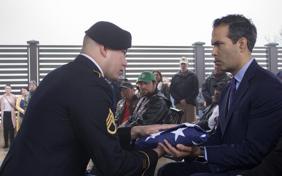 Texas Land Commissioner George P. Bush accepts a folded flag on behalf of Maj. Lee Shotwell Jr. on March 12, 2019, at the Central Texas State Veterans Cemetery in Killeen. Shotwell died Nov. 20 at age 73 with no known family. As part of Veterans Land Board program to provide funerals for unaccompanied veterans, Shotwell was the 100th veteran so honored by the state. 