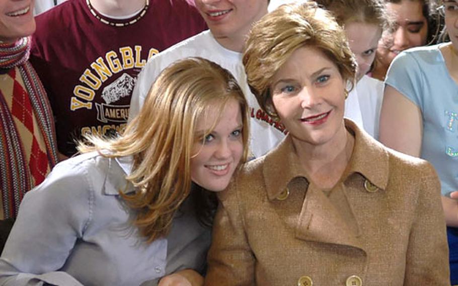 First Lady Laura Bush poses for a photo with students at Gen. H.H. Arnold High School.