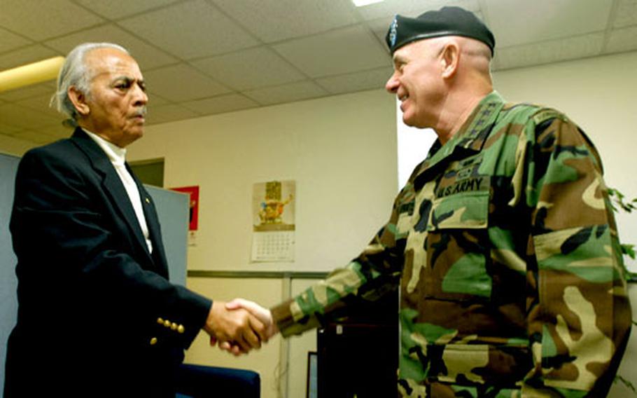 Gen. Leon LaPorte, U.S. Forces Korea commander, right, greets retired Lt. Col. Herbert Carter Monday at Yongsan Garrison, South Korea. Carter, a member of the famed first all-black fighter squadron, the Tuskegee Airmen, spoke at Osan Air Base, South Korea, for Black History Month.