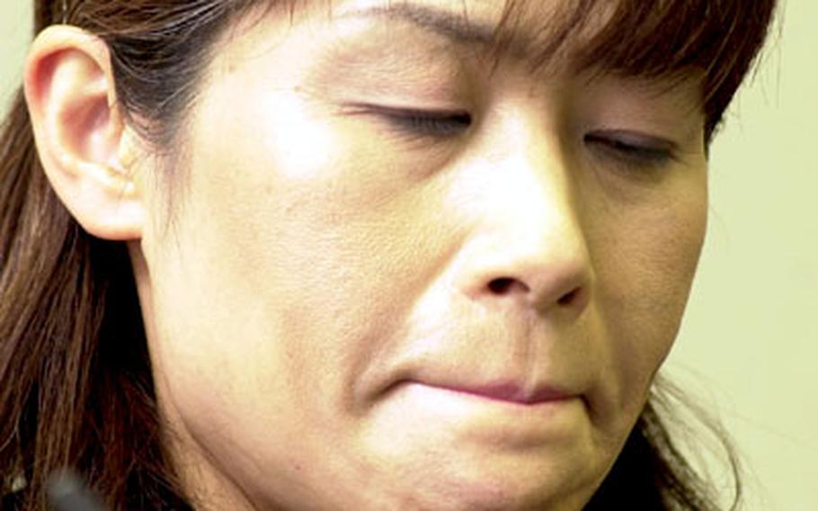 Masumi Terata, mother of one of the Ehime Maru victims, pauses to collect herself while recounting her meeting Monday with former Navy Cmdr. Scott Waddle.