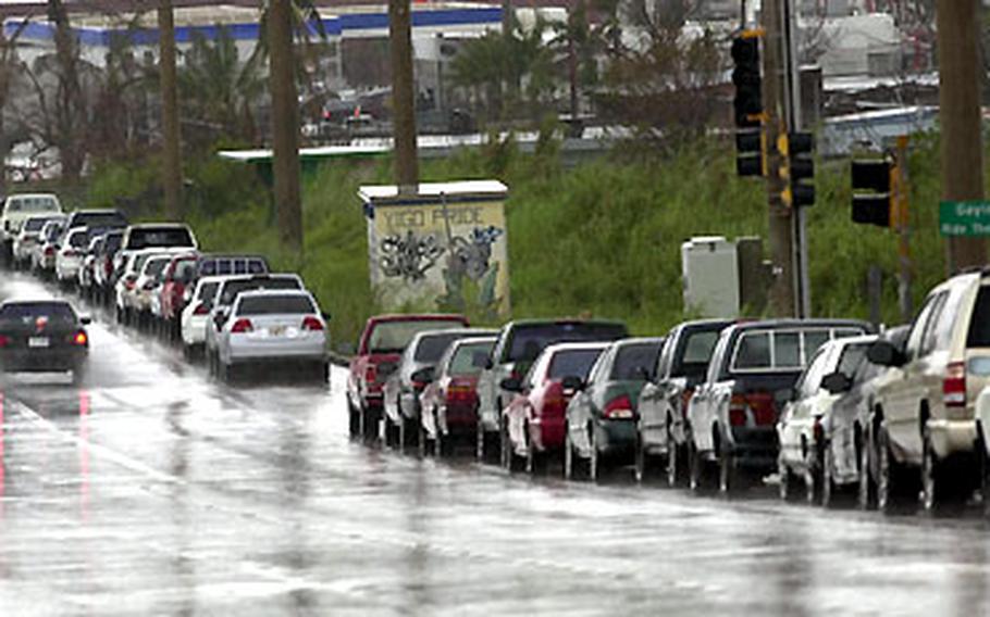 The line for gasoline on typhoon-ravaged Guam stretched for more than a mile Sunday after the government announced the pumps would open at 4 p.m. that day.