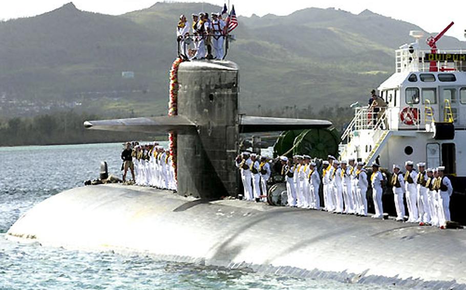 The USS San Francisco and her crew pull into the submarine’s new port of Apra Harbor, Guam, on Wednesday.