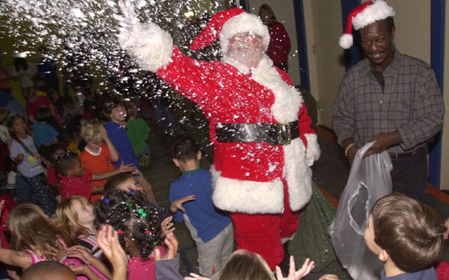 Santa spread some "snow" across students at Stearley Heights Elementary School on Kadena Air Base, Okinawa. Students gave Santa nearly 700 holiday cards and letters to be delivered to servicemembers deployed overseas from Okinawa.