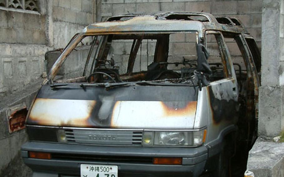 Okinawa police suspect an arsonist set the fire that gutted this van, owned by a Marine, in Chatan early Tuesday.