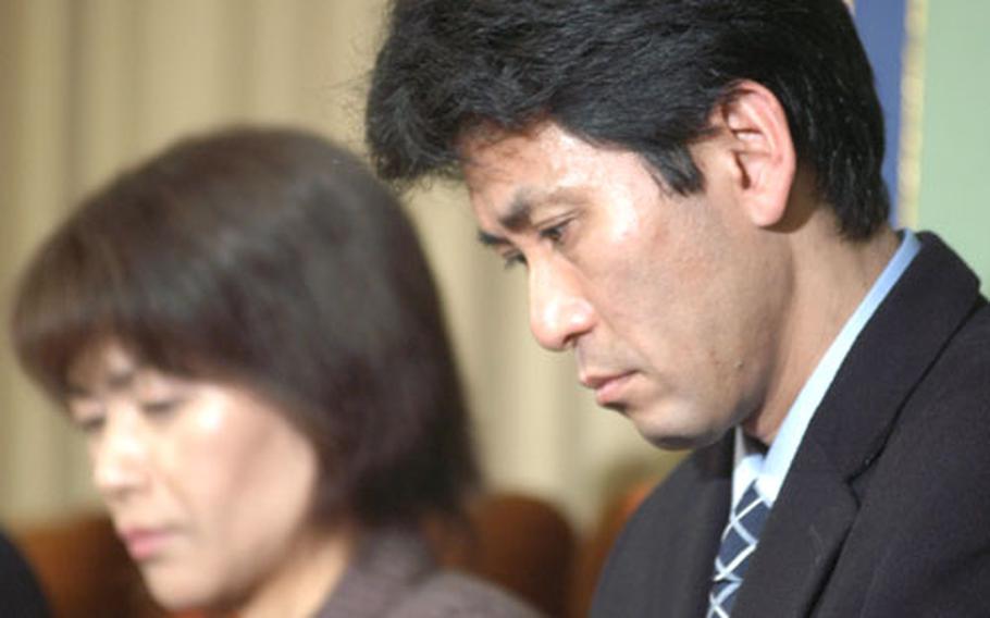 Masumi, left, and Ryosuke Terata, parents of one of the students killed in February 2001 in the USS Greeneville/Ehime Maru accident, speak to reporters last week after settling with the U.S. Navy.