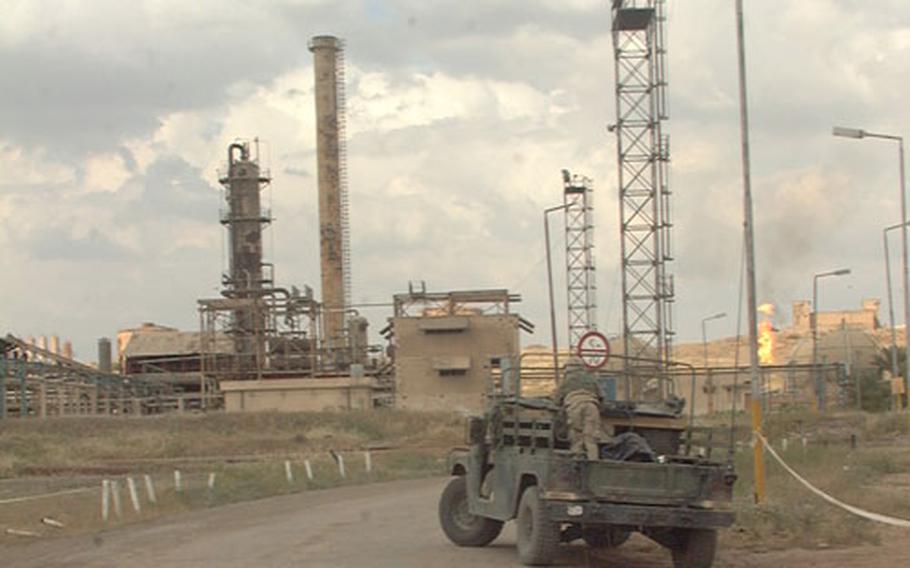 A large oil facility just north of Kirkuk is under the watchful eyes of soldiers assigned to Delta Battery, 319th Field Artillery, 173rd Airborne Brigade. The artillery unit moved in shortly after the area fell to coalition forces in mid-April. Soldiers patrol the facility on foot as well as by Humvee.