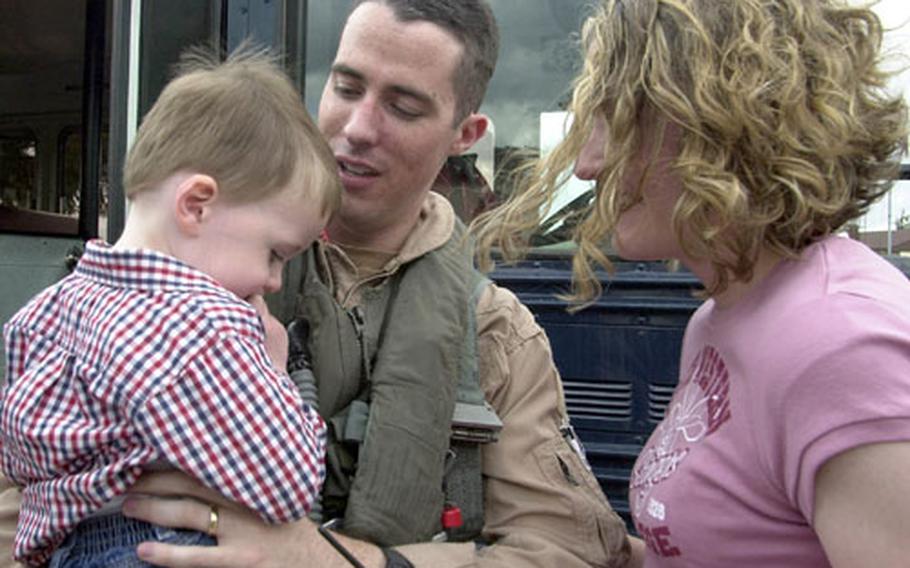 Connor O&#39;Malley, 2, looks a little shy as he and his mom, Samantha, welcome dad, Capt. Derek O&#39;Malley back to Spangdahlem Air Base, Germany.
