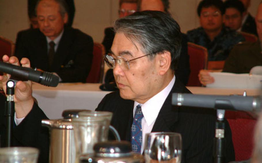 Okinawa Gov. Keiichi Inamine addresses the Tripartite Liaison Committee Friday.