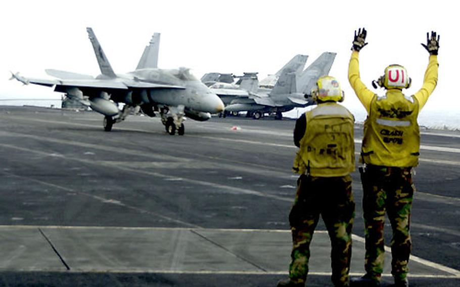 An F/A-18 Hornet makes a successful landing on the USS Carl Vinson during recent flight operations.