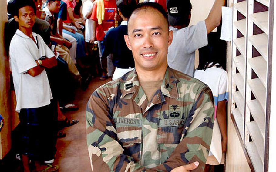 U.S. Army Capt. Ed Oliveros is a native Filipino who returned to his homeland this month to lead the U.S. humanitarian and civic mission in the southern Philippines. He’s standing at a Medical Civil Action Project near Zamboanga City.