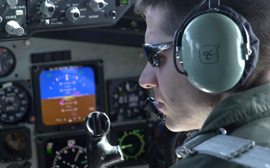 1st Lt. Jeff Guttman keeps his eyes on readouts and dials in the cockpit of a KC-135R tanker flying over the Sea of Japan Tuesday during Cope North exercises.