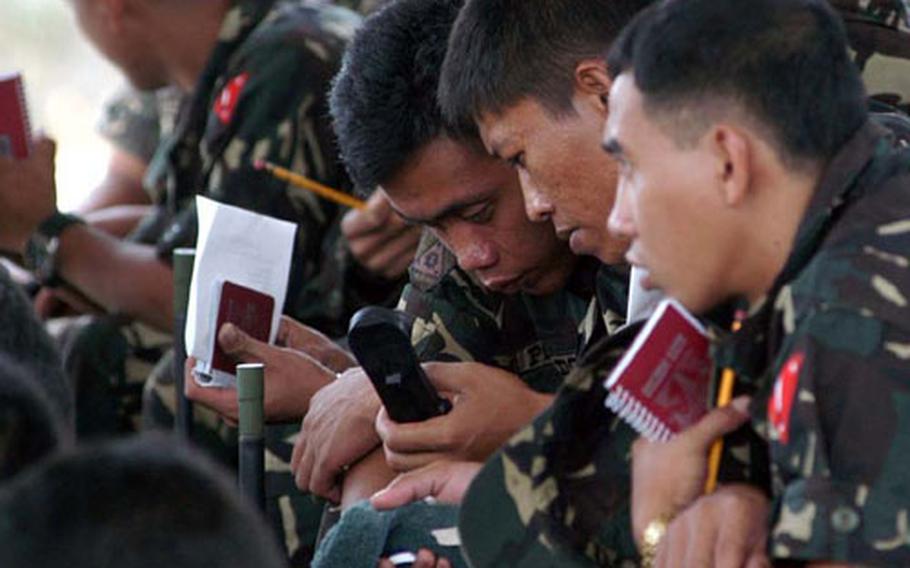 Philippine servicemembers learn communications using U.S.-purchased radios as part of a Security Assistance Module in the southern Philippines.