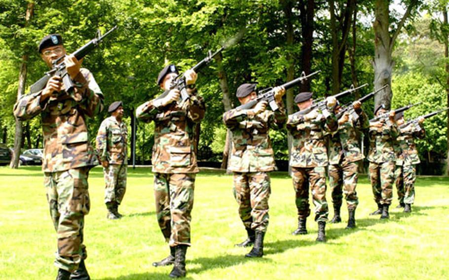 Members of the 200th Material Management Center of the 21st Theater Support Command practice firing a salute in preparation for Memorial Day events.