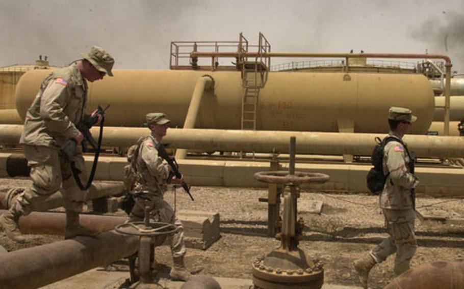 Military intelligence analysts who spent the war within the confines of Camp Doha, Kuwait got a chance to escape this week for a day’s adventure through the Rumallah oil fields.