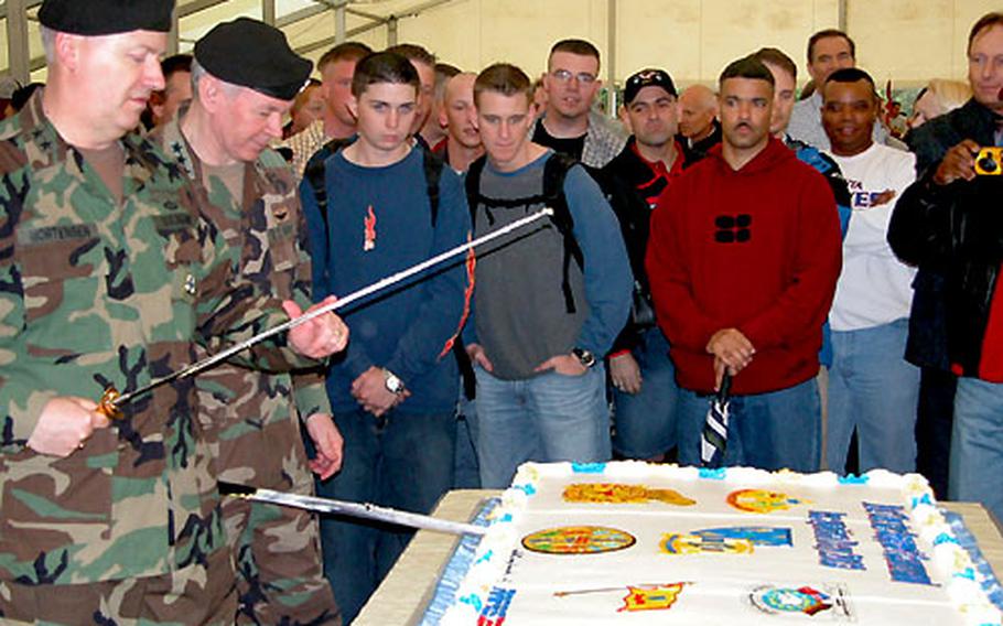 Maj. Gen. William E. Mortensen, left, and Lt. Gen. Michael Dodson cut the cake Thursday at a celebration at the Rhein Ordnance Barracks, Kaiserslautern.