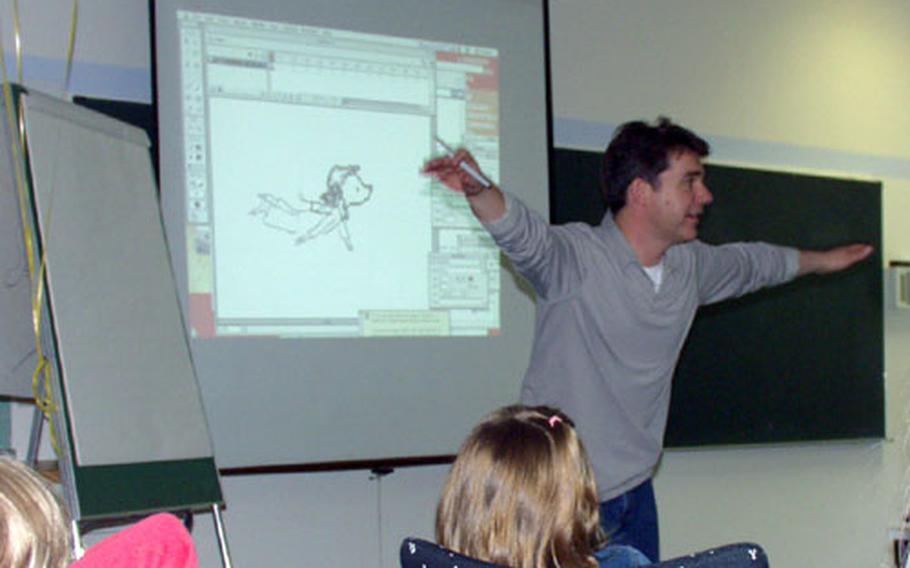 Peter Reynolds, a writer and illustrator, showed students how to make characters come to life using multimedia techniques.