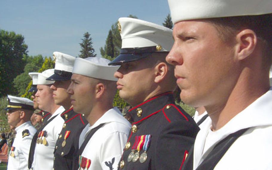 Sailors and Marines stand at a Memorial Day ceremony Sunday at the Rhone American Cemetery in Draguignan, France.