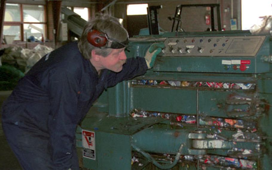 A worker at the Endurvinnslan Recycling Plant in Reykjavík checks the machine responsible for compacting all the plastic bottles collected. Once enough bottles are compressed inside, he will insert metal bindings into the open slots to help tie up the bundle and get it ready to be pushed out of the machine. Once the bottles are packaged, they will be shipped out of the country and eventually be used in the manufacturing of clothing.