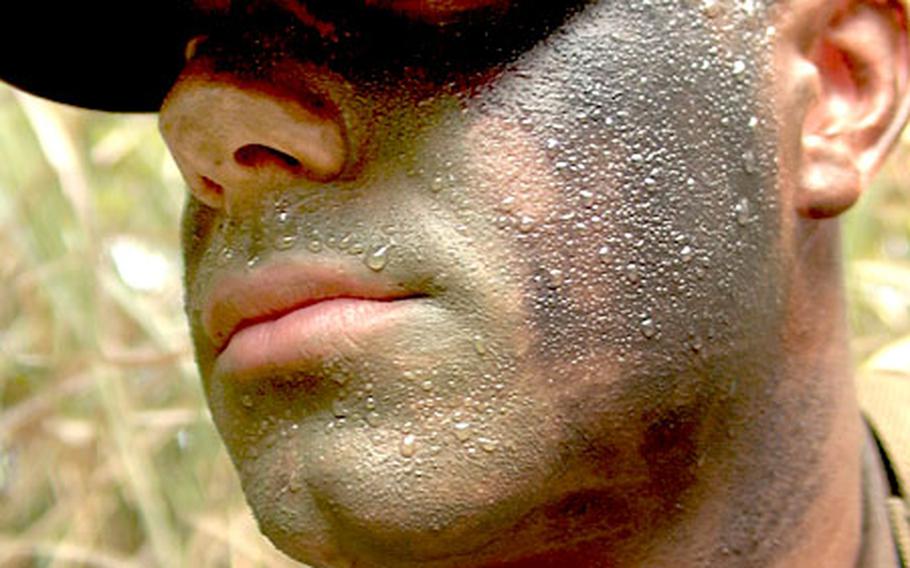 Sweat beads up on Marine Pfc. Rusty Thrasher, a Stinger missile gunner, during training at Camp Hansen.