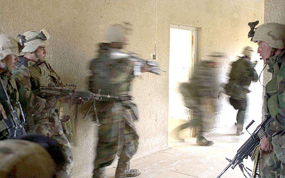 Movement through a schoolhouse in Al Fahr, Iraq, is fast and furious.