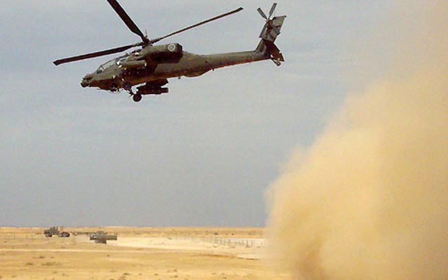 An AH-64A Apache heads out on a mission against the former stronghold of the Iraqi Republican Guard’s Medina Division south of Baghdad.