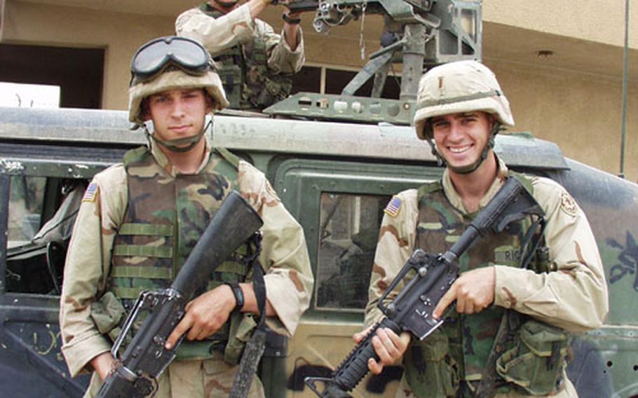 Pfc. Jason Johns (left), Sgt. Daniel Hicks, manning the M2 gun, and 2nd Lt. Chris Ricci get ready to patrol Thawra, one of Baghdad&#39;s toughest neighborhoods. The soldiers are from 2nd Armored Cavalry Regiment, 2nd Squadron, Fox Troop.