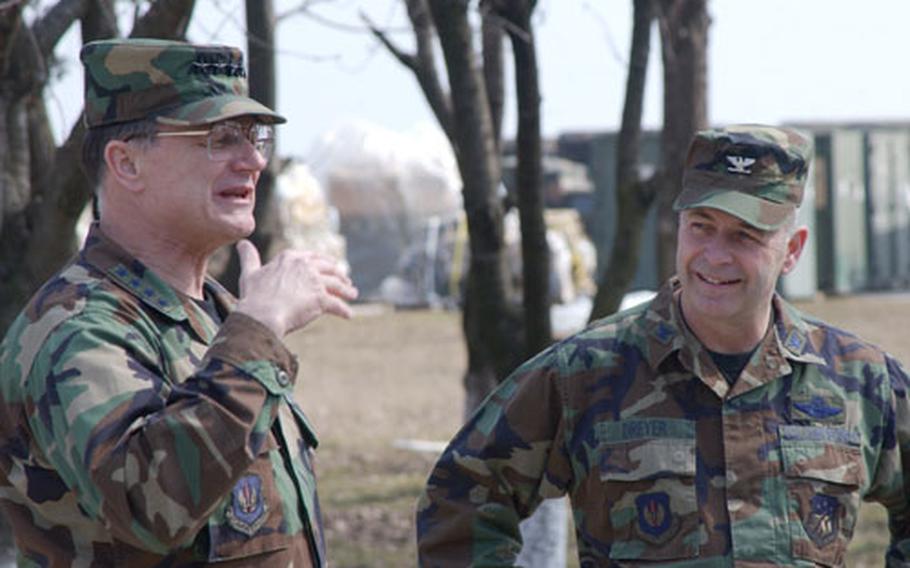 U.S. Air Forces in Europe commander Gen. Gregory S. Martin talks with Col. Steven Dreyer, commander of the 458th Air Expeditionary Group in Constanta, Romania. The base, which is being used to support an air bridge bringing troops and supplies to Operation Iraqi Freedom, could be the future site of a Forward Operating Base under EUCOM commander Gen. James Jones&#39; plan.