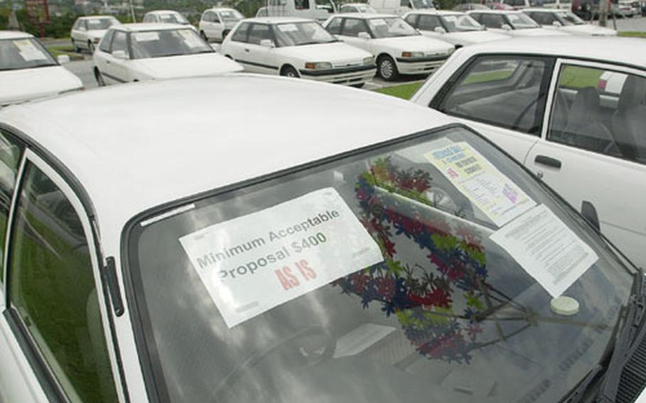 On the windshield of each vehicle that AAFES at Camp Foster, Okinawa, plans to sell is information on the year, make and model as well as the minimum bid requirement.