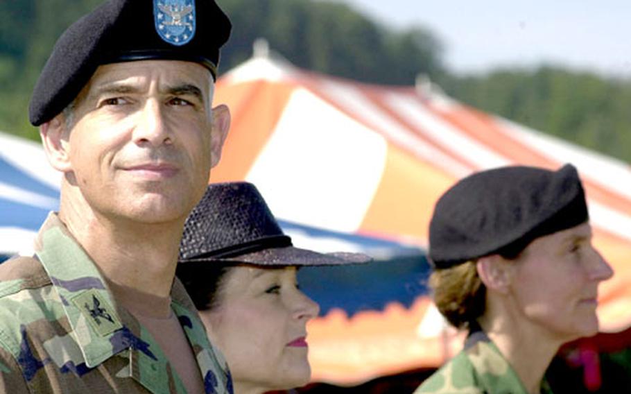 Col. David Rubenstein, left, watches over his troops with his wife, Patricia, in Kaiserslautern, Germany, on Friday as he hands over his command to Col. Rhonda Cornum, far right. Rubenstein commanded Landstuhl Regional Medical Center for three years.