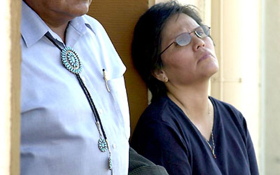 James Benally and Kristen June, stepfather and mother of murder victim Spc. Clint Lamebear, leave the trial of their son&#39;s killers in Wiesbaden, Germany, on Tuesday.