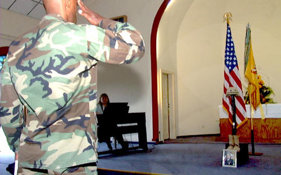 A solider offers a salute to Army Sgt. David B. Parson. A memorial service for Parson, shot and killed in Iraq on July 6, was held Wednesday morning at the chapel on Ray Barracks in Friedberg, Germany.