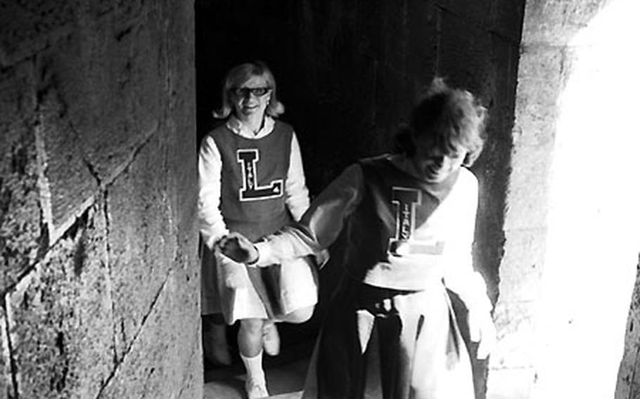 Leghorn High cheerleaders walk up the steps of the tower.