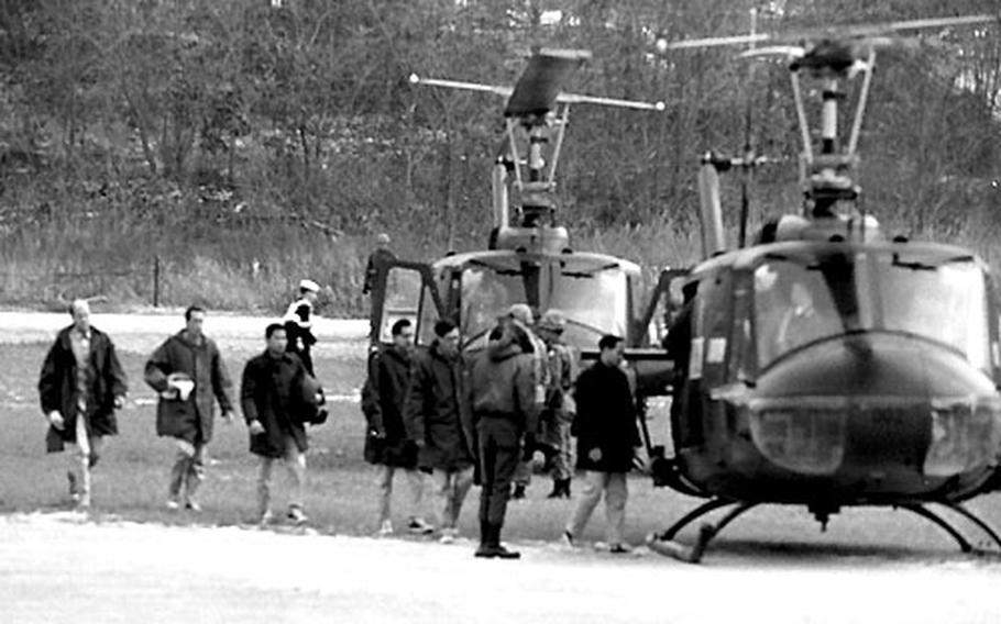 Pueblo crew members board helicopters for a trip to the 121st Evac. Hospital at ASCOM following their release from North Korean captivity.