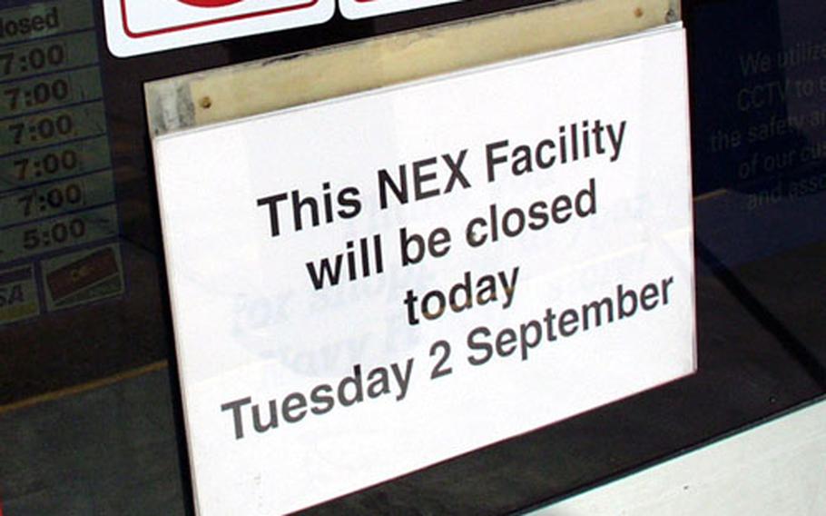 This sign was how many prospective shoppers found out about the strike-related closure of the Naples Navy Exchange and Commissary Tuesday, although security guards were telling some of those entering the base.