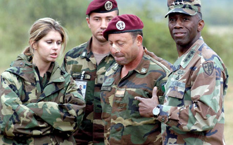 Ward, right, commends Di Prospero, second from right, for being flexible and responding well when things did not go right. An identified interpreter and another Italian soldier are with Ward and Di Prospero.