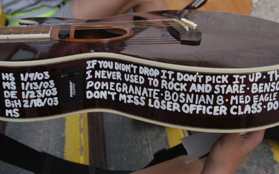 1st Lt. Sarah Kuhaneck used her guitar for more than just playing music. The guitar she bought during the deployment served as her journal, too.