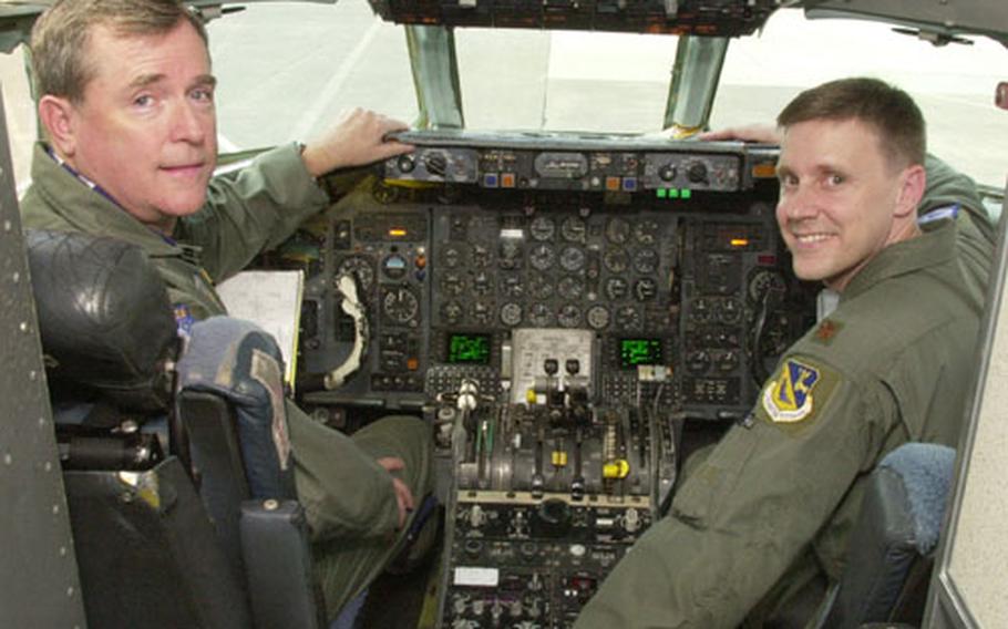 Gen. Thomas Waskow, left, and Maj. Scott Schaeffer smile from the cockpit of a C-9 prior to the general&#39;s flight. The Air Force will retire the C-9 Sept. 12th in the Pacific and replace it with the KC-135 for transporting MEDIVAC patients.