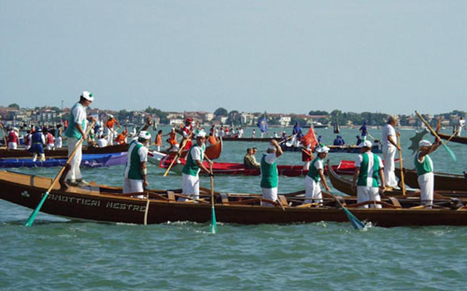 Dozens of gondolas representing nearby cities or Venice area organizations gather Sunday in the ceremonial portion of the Regata Storica in the grand canal. The Historic Regata celebrates the arrival of the Queen of Cyprus into Venice hundreds of years ago and features several competitions.